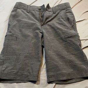 Grey jean shorts, they are button up.
